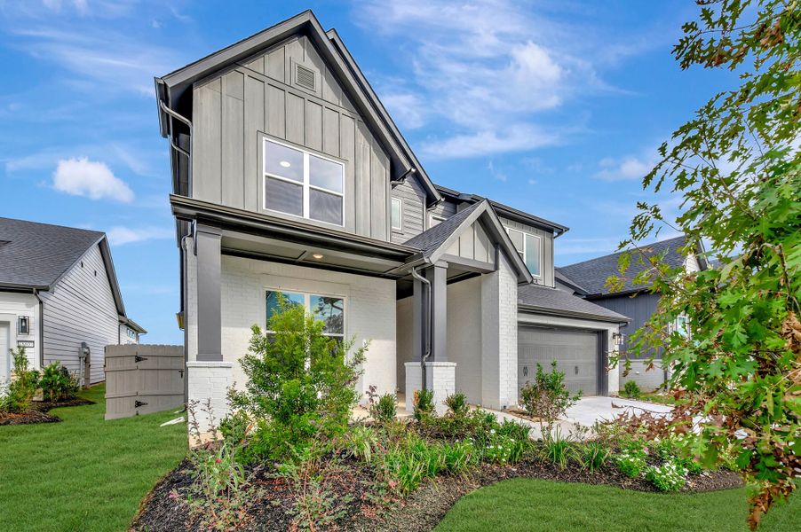 Front exterior of a new home in ARTAVIA - Enclave Collection, Conroe, TX, highlighting curb appeal (Image 2).