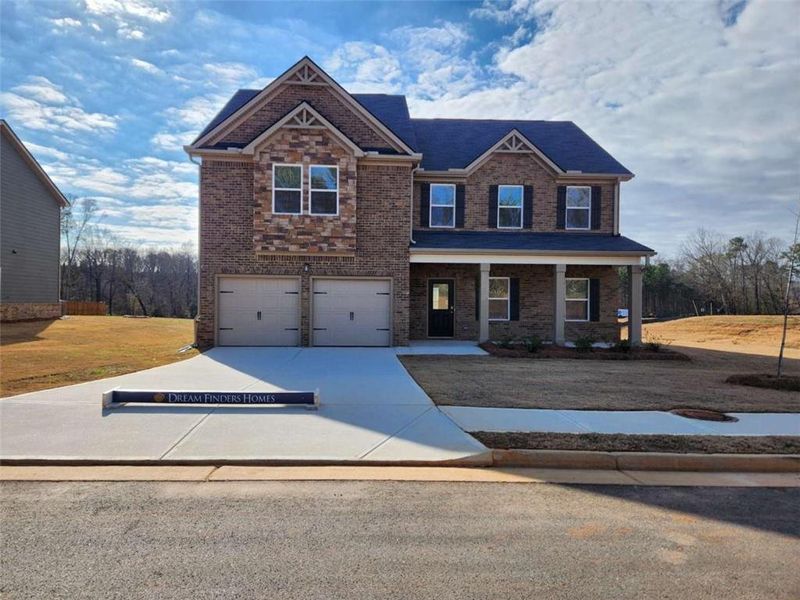 Front exterior of a new home in Southern Hills, McDonough, GA, highlighting curb appeal (Image 24).