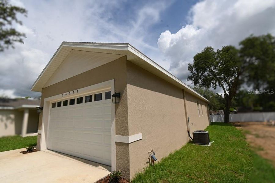 Front exterior of a new home in , Dade City, FL, highlighting curb appeal (Image 18).