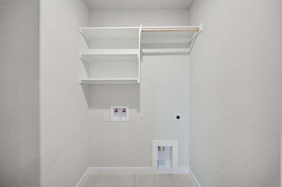 Utility Room in the Masters home plan by Trophy Signature Homes – REPRESENTATIVE PHOTO