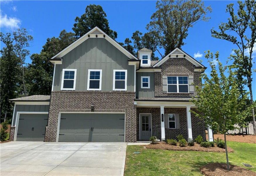Front exterior of a new home in Rosewood Lake Preserve, Hoschton, GA, highlighting curb appeal (Image 22). Front exterior of a new home in Rosewood Lake Preserve, Hoschton, GA, highlighting curb appeal (Image 22).