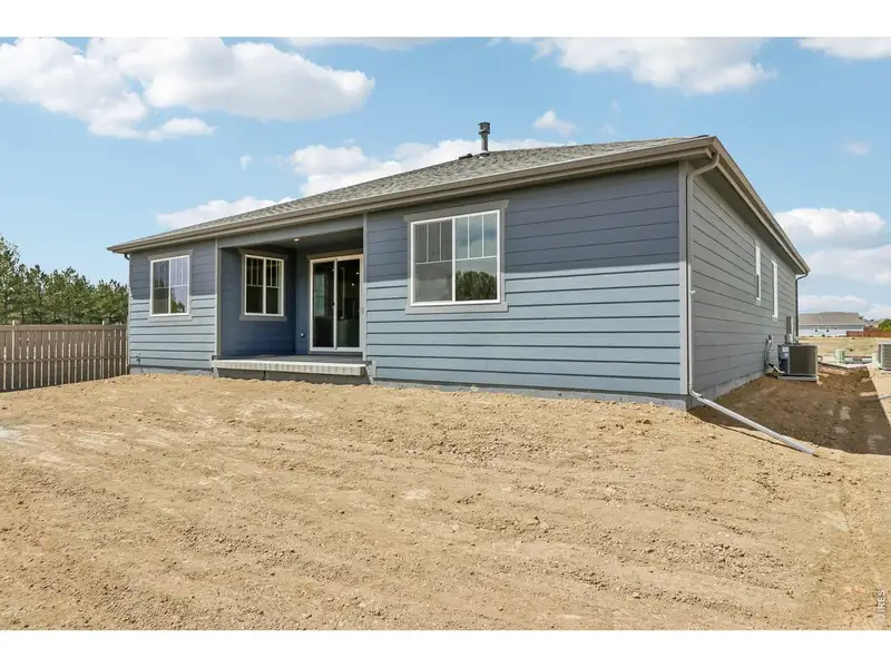 Exterior details and patio area of a home in Farmstead, Berthoud (Image 3).