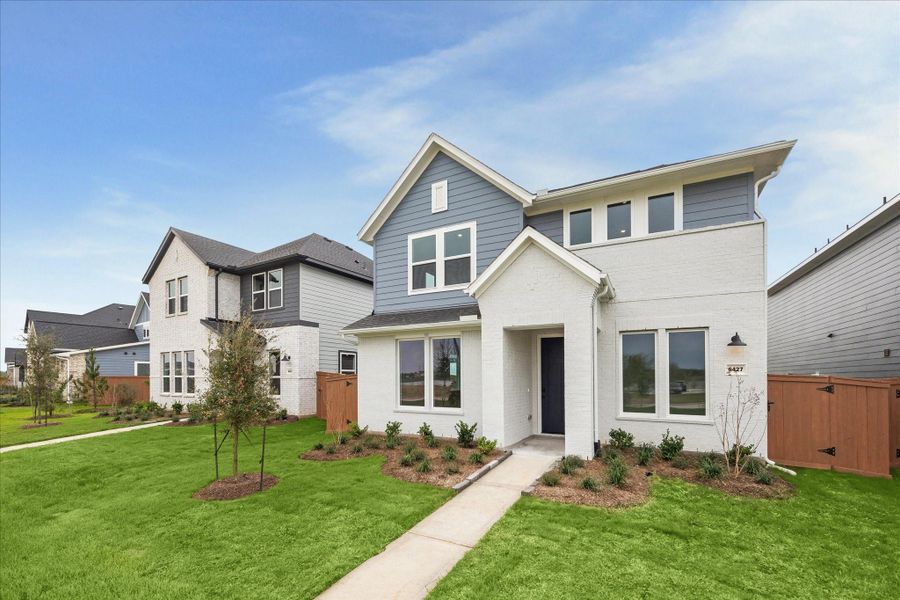 Front exterior of a new home in Elyson, Katy, TX, highlighting curb appeal (Image 19). Front exterior of a new home in Elyson, Katy, TX, highlighting curb appeal (Image 19).