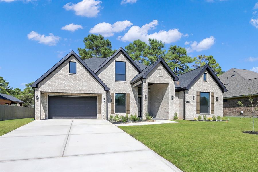 Welcoming front elevation with covered entry and stylish lighting Welcoming front elevation with covered entry and stylish lighting