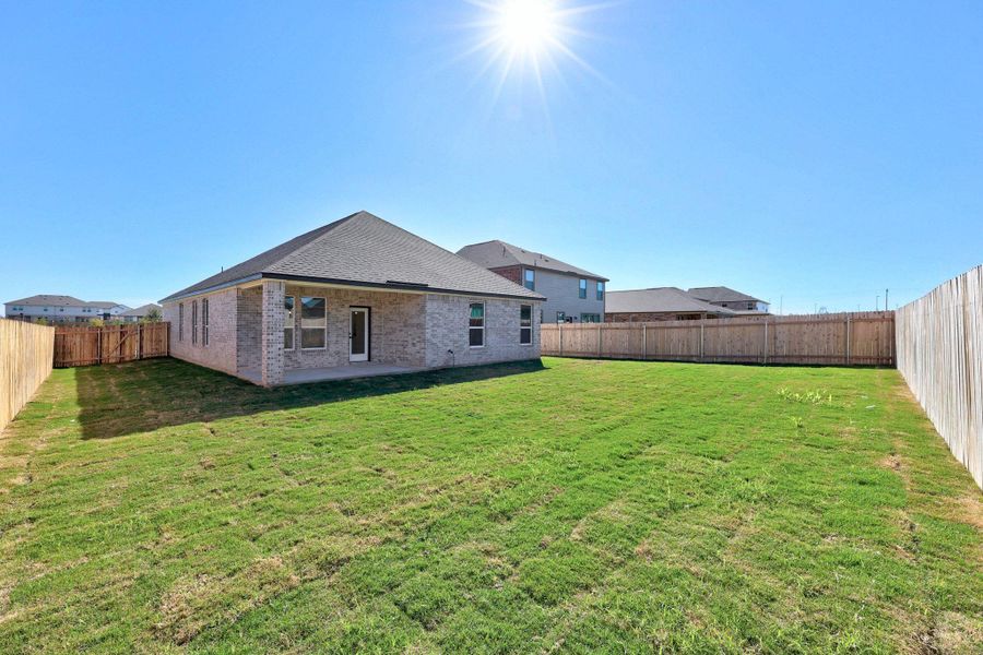 Exterior details and patio area of a home in Mustang Valley, Manor (Image 17).
