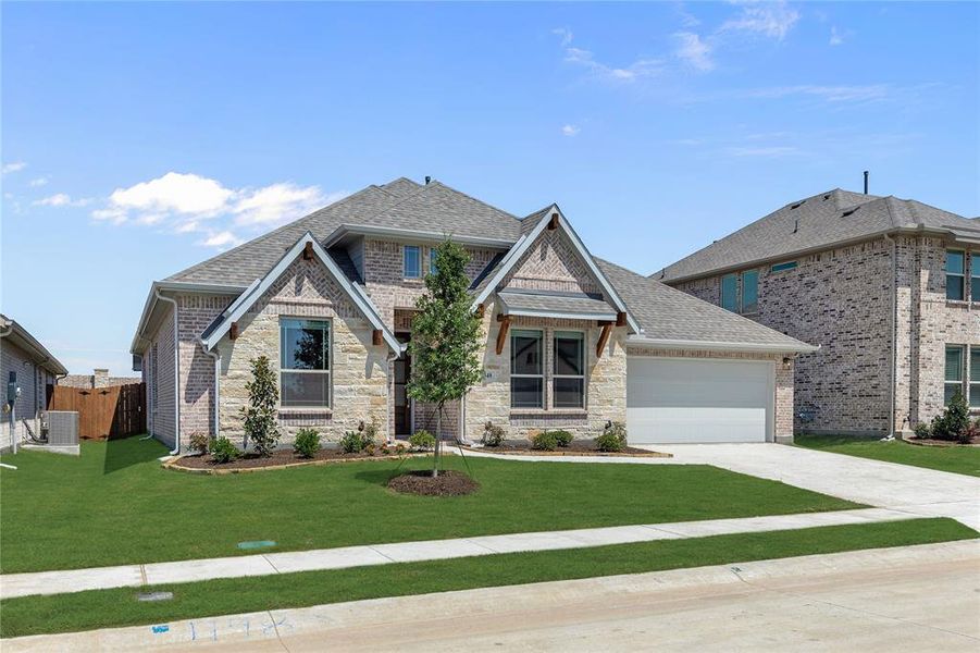 Front exterior of a new home in Chaparral Park, Oak Point, TX, highlighting curb appeal (Image 2).