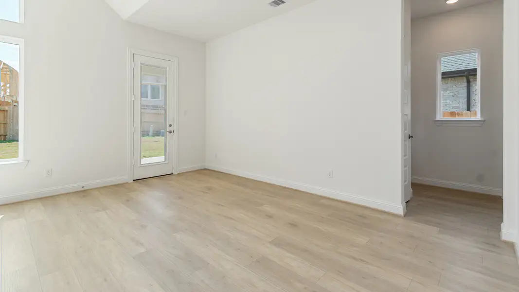 Representative furnished interior of a home built from the Vanderbilt by DRB Homes in Creekhaven, Iowa Colony (Image 9).