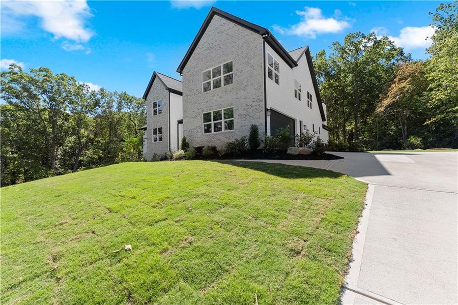 Front exterior of a new home in , Baldwin, GA, highlighting curb appeal (Image 31).