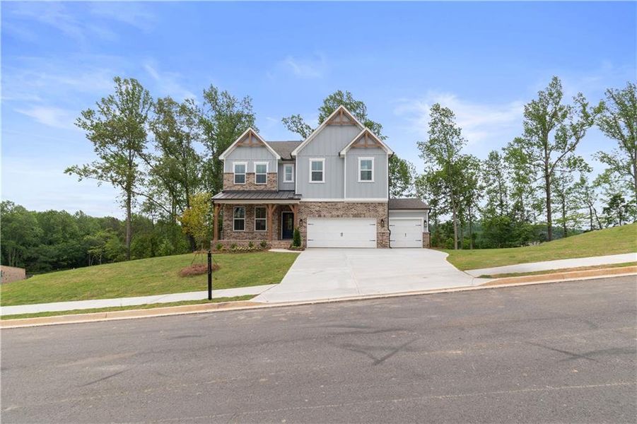 Front exterior of a new home in Tiberon Woods, Cumming, GA, highlighting curb appeal (Image 22).