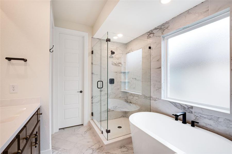 Frameless Shower with a Separate Garden Tub