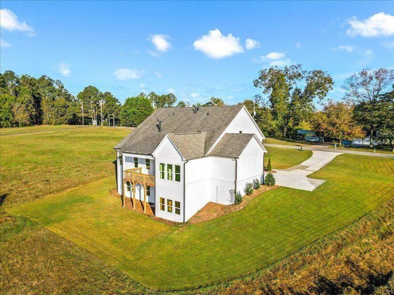 Front exterior of a new home in Brooks Pond, Cumming, GA, highlighting curb appeal (Image 22).