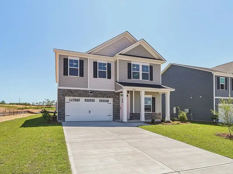 Front exterior of a new home in Providence Station at Trolley Run, Aiken, SC, highlighting curb appeal (Image 13). Front exterior of a new home in Providence Station at Trolley Run, Aiken, SC, highlighting curb appeal (Image 13).