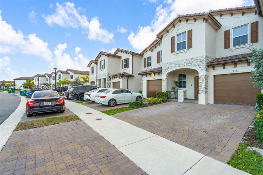 Front exterior of a new home in , Miami, FL, highlighting curb appeal (Image 19).