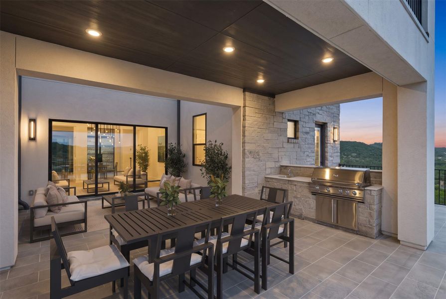 Exterior details and patio area of a home in The Estates at Rough Hollow Vista Ridge, Lakeway (Image 4).
