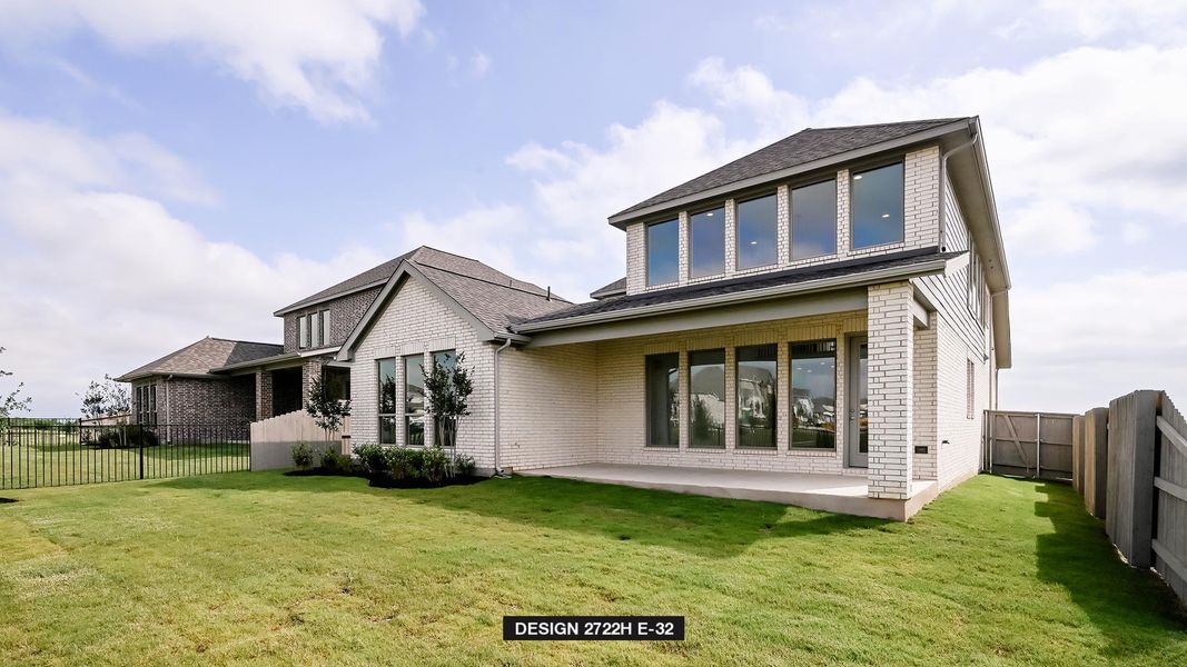 Rear view of house featuring brick siding, a patio, a fenced backyard, and roof with shingles