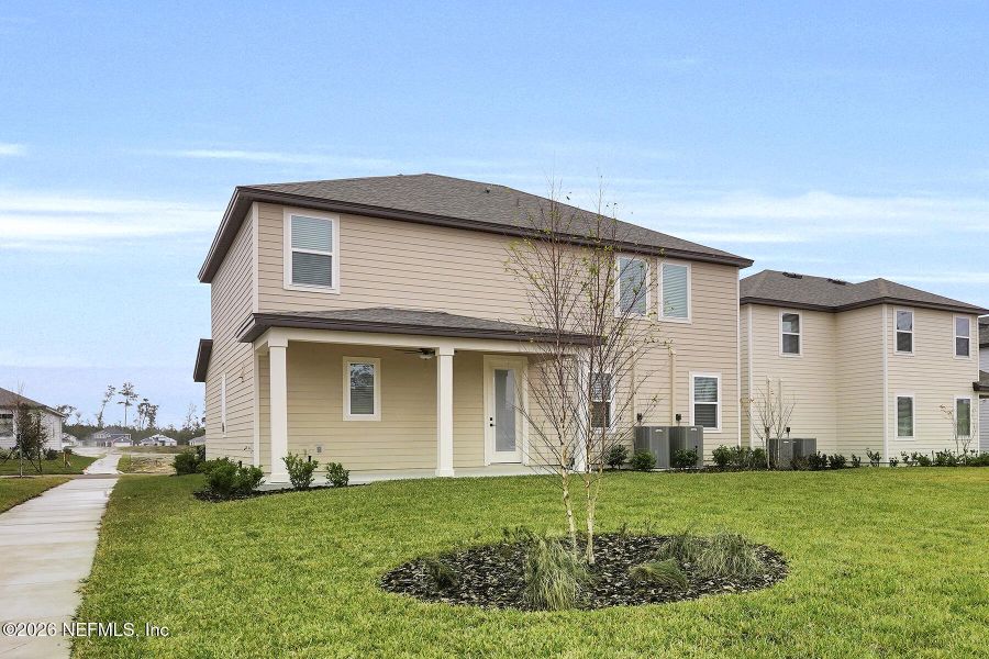 Front exterior of a new home in Jennings Farm, Middleburg, FL, highlighting curb appeal (Image 19).