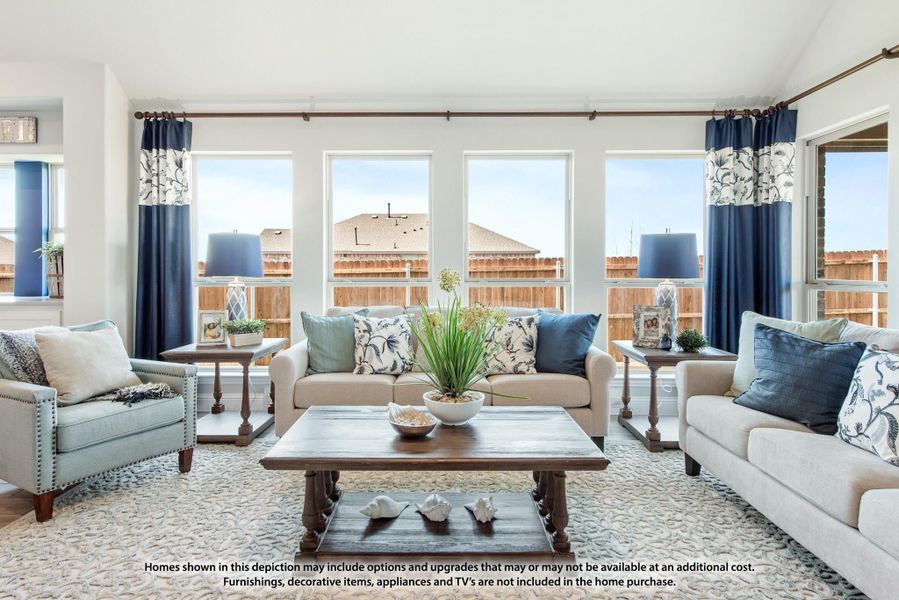 Living room with beige sofas, navy blue curtains, wood coffee table, and large windows with natural light