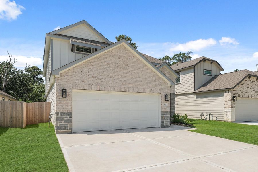 Front exterior of a new home in Cypresswood Landing, Humble, TX, highlighting curb appeal (Image 22).