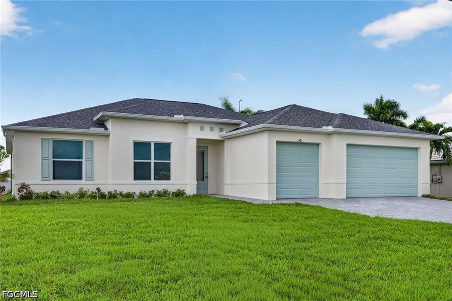 Front exterior of a new home in Cape Coral, Cape Coral, FL, highlighting curb appeal (Image 1). Front exterior of a new home in Cape Coral, Cape Coral, FL, highlighting curb appeal (Image 1).