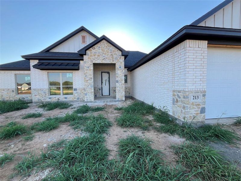 Front exterior of a new home in , Millsap, TX, highlighting curb appeal (Image 2).