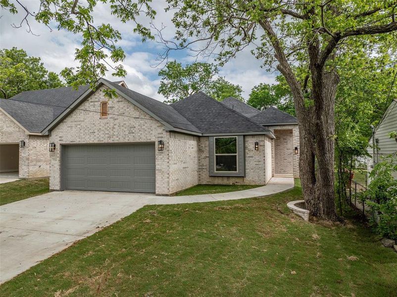 Front exterior of a new home in , Sherman, TX, highlighting curb appeal (Image 21).