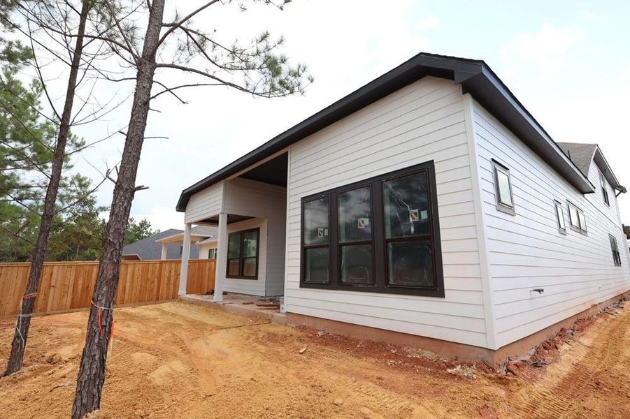 Front exterior of a new home in Kresston, Magnolia, TX, highlighting curb appeal (Image 17).