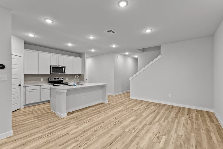 A kitchen with white cabinets. A kitchen with white cabinets.