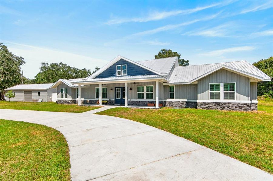 Front exterior of a new home in , Hudson, FL, highlighting curb appeal (Image 2). Front exterior of a new home in , Hudson, FL, highlighting curb appeal (Image 2).