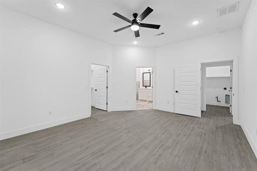 Primary Bedroom with walk-in closet and en suite bathroom.