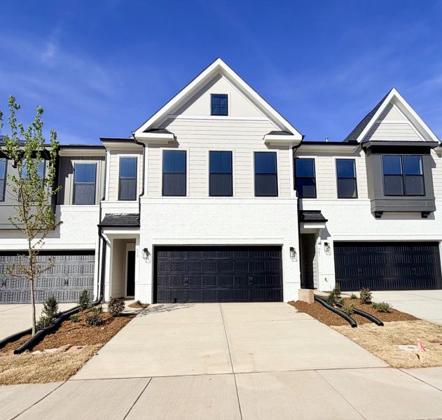 Front exterior of a new home in Sweetbrier, Durham, NC, highlighting curb appeal (Image 1). Front exterior of a new home in Sweetbrier, Durham, NC, highlighting curb appeal (Image 1).