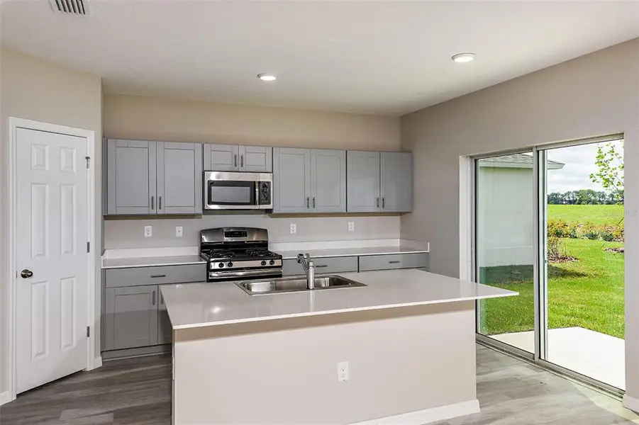 Furnished interior view inside a new home in Pasadena Ridge, Dade City (Image 2).