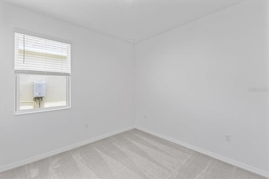 Spacious, unfurnished interior of a new home in Highfield at Twisted Oaks, Wildwood (Image 7).