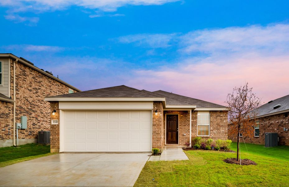 The Hewitt, a one-story home with 2-car garage, shown with Home Exterior N