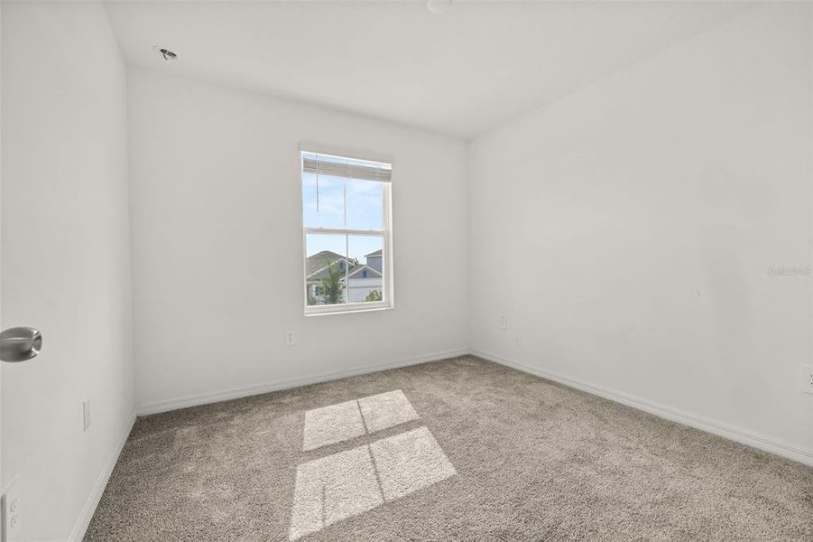 Spacious, unfurnished interior of a new home in Peace Creek Reserve, Winter Haven (Image 24).