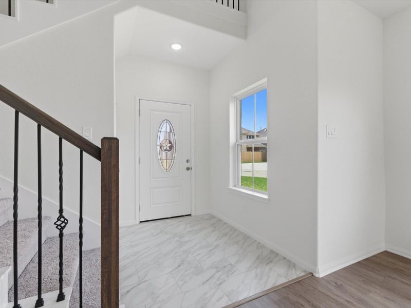 High ceilings and bright natural light create a bright, polished welcome into this thoughtfully designed new construction home. High ceilings and bright natural light create a bright, polished welcome into this thoughtfully designed new construction home.