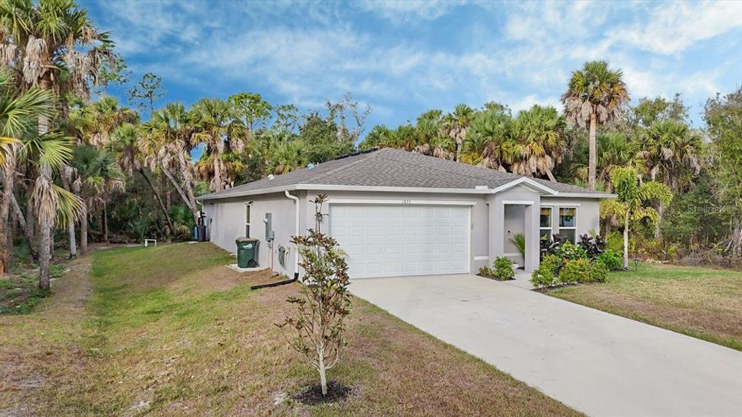 Front exterior of a new home in , North Port, FL, highlighting curb appeal (Image 25).