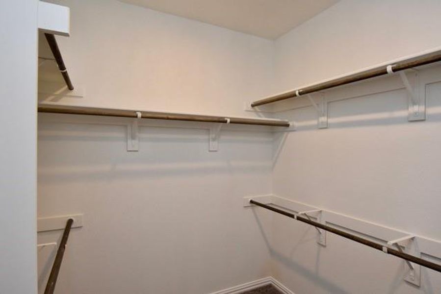 Primary walk-in closet Primary walk-in closet