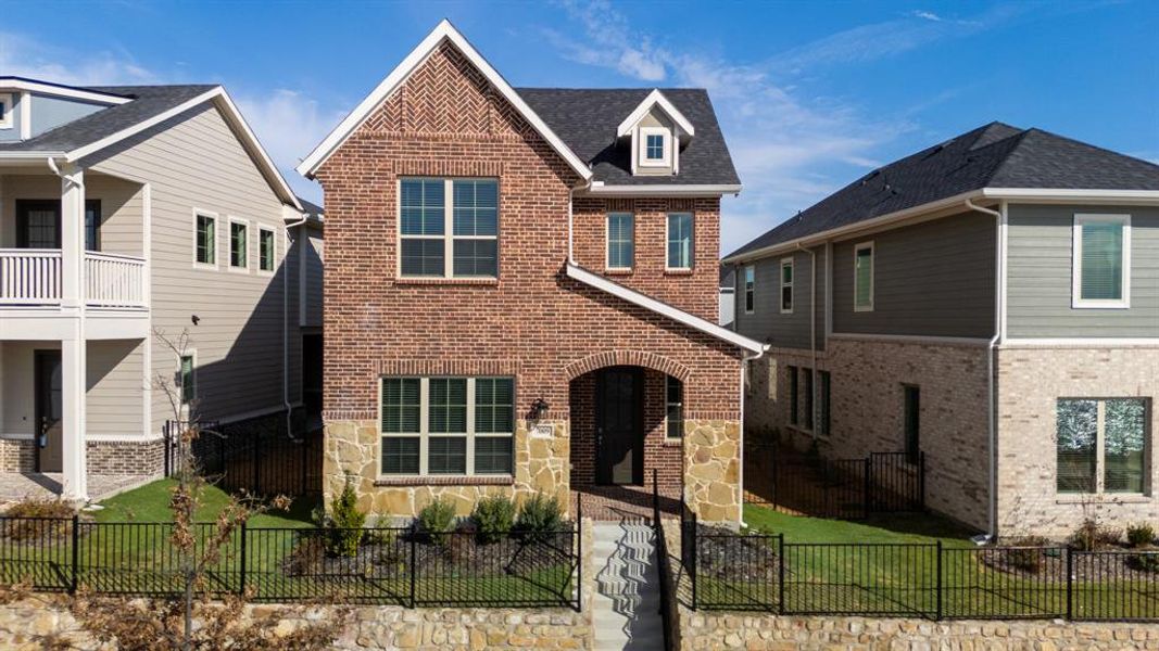 Front exterior of a new home in Bayside, Rowlett, TX, highlighting curb appeal (Image 17). Front exterior of a new home in Bayside, Rowlett, TX, highlighting curb appeal (Image 17).