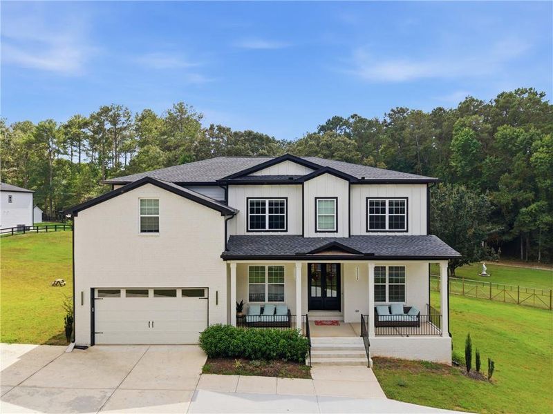 Front exterior of a new home in , Snellville, GA, highlighting curb appeal (Image 2). Front exterior of a new home in , Snellville, GA, highlighting curb appeal (Image 2).