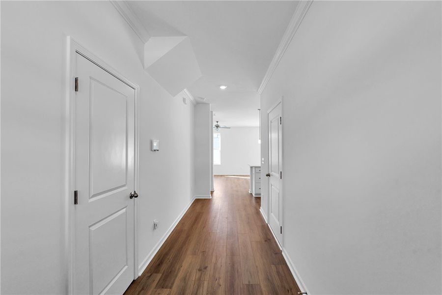 This bright hallway showcases rich hardwood floori This bright hallway showcases rich hardwood floori