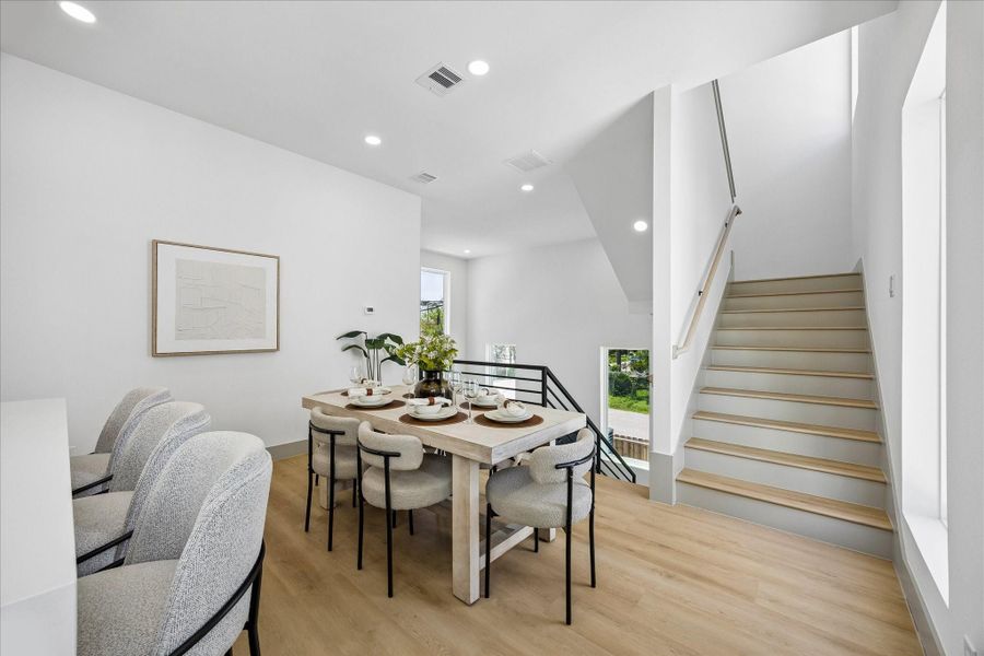 Positioned between the kitchen and living room, the dining space keeps everyone connected whether hosting friends or enjoying everyday meals. Positioned between the kitchen and living room, the dining space keeps everyone connected whether hosting friends or enjoying everyday meals.