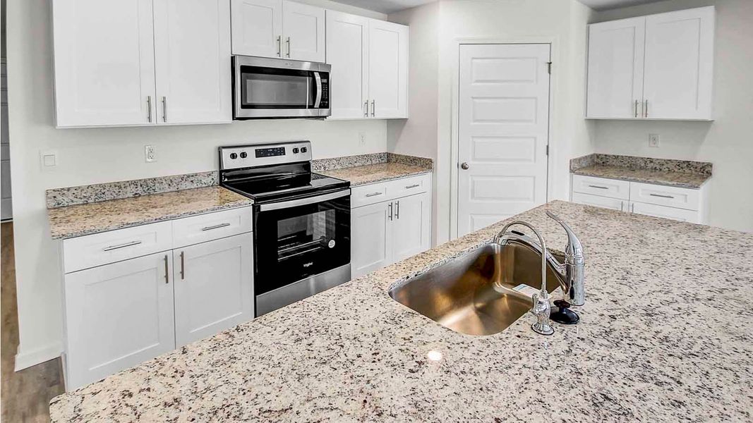 Representative furnished interior of a home built from the Lismore by D.R. Horton in Ashton Park Phase III, Freeport (Image 7).