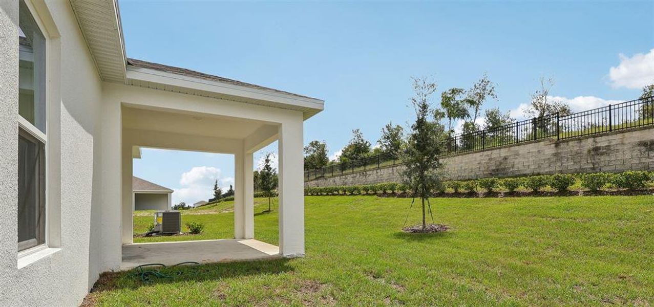Exterior details and patio area of a home in Eagletail Landings, Howey-in-the-Hills (Image 3).