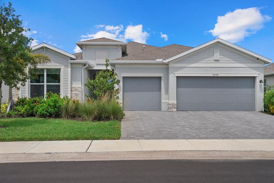 Front exterior of a new home in , Englewood, FL, highlighting curb appeal (Image 21).