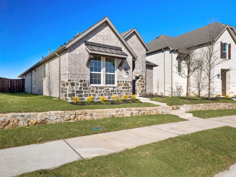 Front exterior of a new home in Edgewater, Fate, TX, highlighting curb appeal (Image 18).