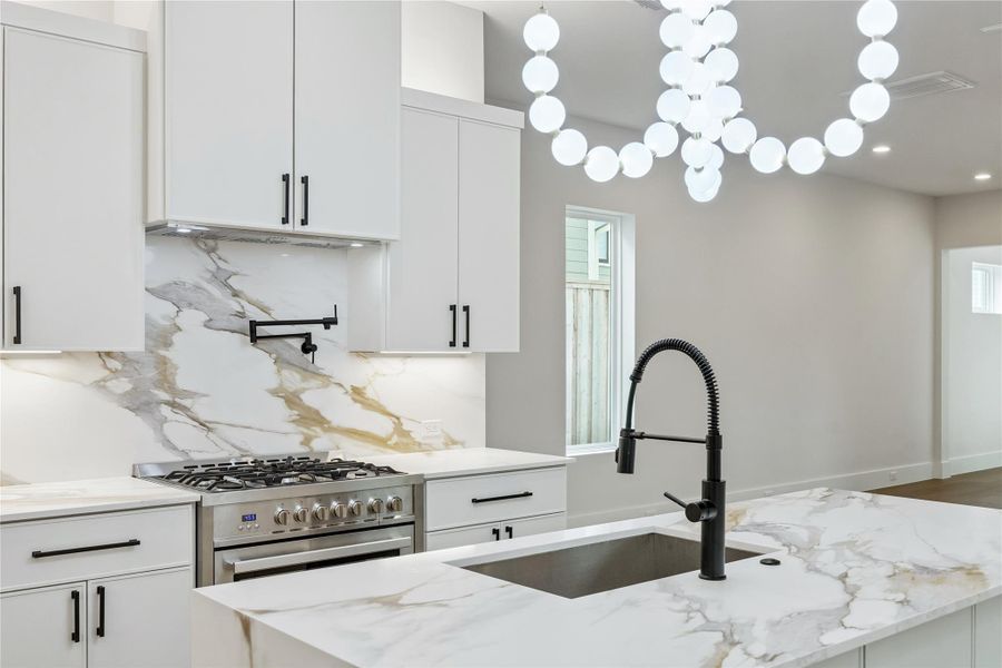 The kitchen layout was designed around both storage and workflow, with extensive cabinetry and uninterrupted prep space throughout. Its positioning keeps the kitchen connected to the rest of the first floor without overwhelming the living areas. The kitchen layout was designed around both storage and workflow, with extensive cabinetry and uninterrupted prep space throughout. Its positioning keeps the kitchen connected to the rest of the first floor without overwhelming the living areas.