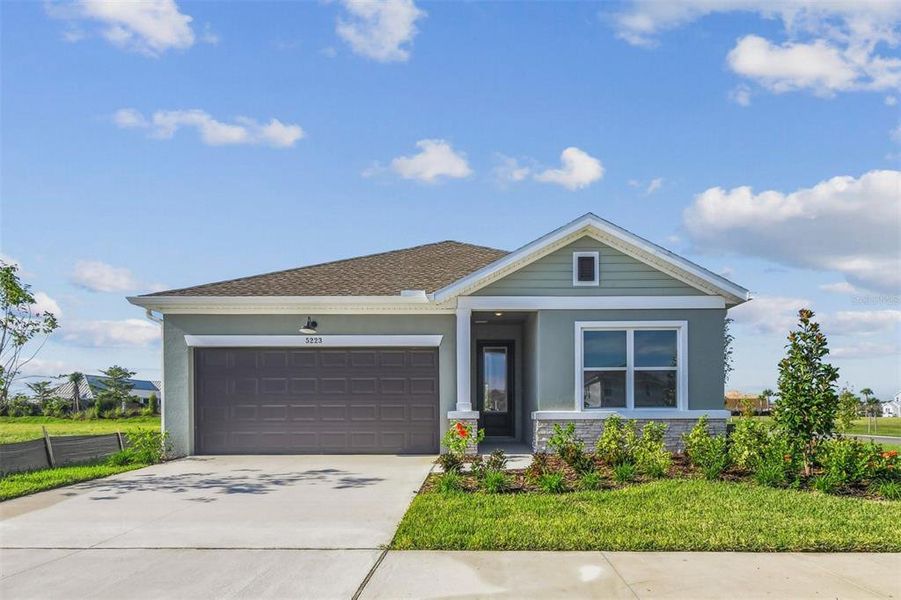 Front exterior of a new home in Waterset Tradition Series, Apollo Beach, FL, highlighting curb appeal (Image 1). Front exterior of a new home in Waterset Tradition Series, Apollo Beach, FL, highlighting curb appeal (Image 1).