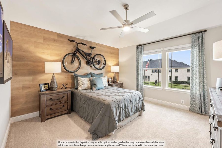 Bedroom with wood accent wall, ceiling fan, carpet, and large window with natural light