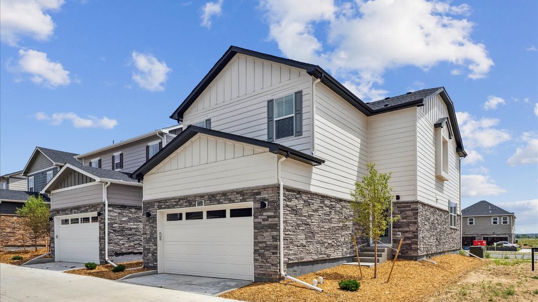 Front exterior of a new home in Horizon Uptown, Aurora, CO, highlighting curb appeal (Image 2).