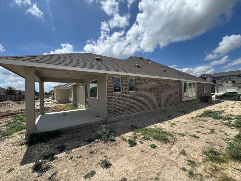 Front exterior of a new home in Village at Three Oaks, Seguin, TX, highlighting curb appeal (Image 15).